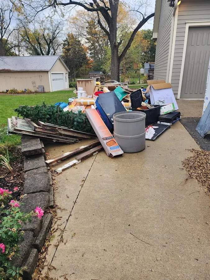 Dumpster being loaded with debris for 3 Yard Dumpster Rental in Mansfield